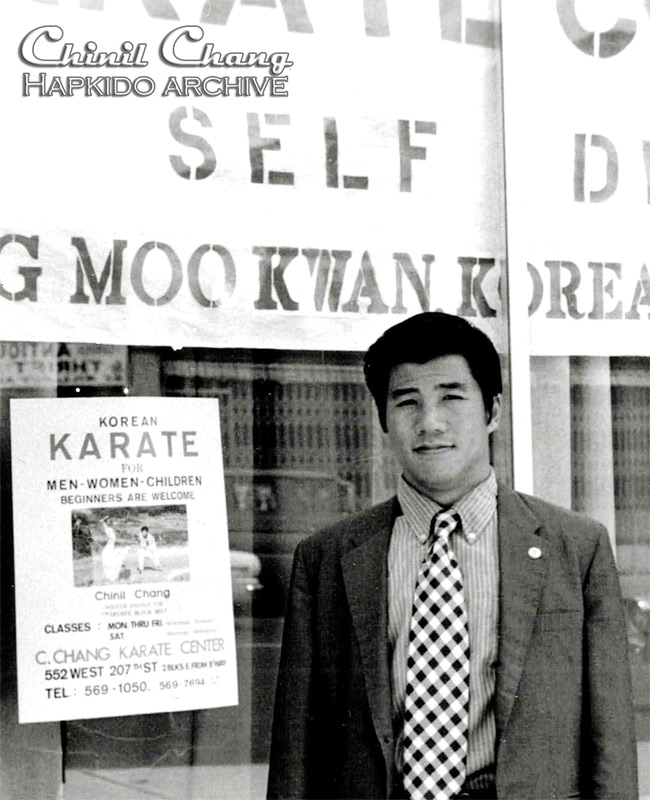 Chang pose in front of one of his schools